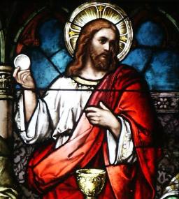 Christ holding Communion host